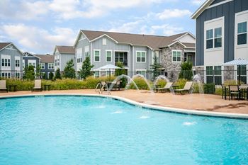 Resort-style swimming pool with cabanas